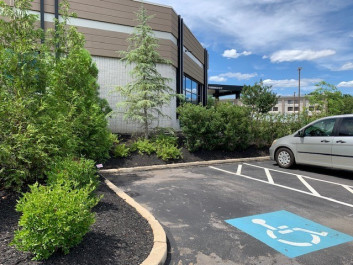 Landscaping work done in a commercial office parking lot.