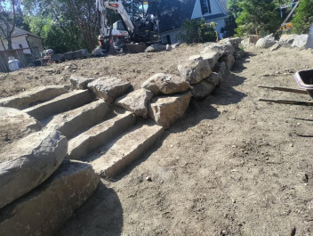 Gladwyne boulder steps and wall coming together. Stay tuned for finished product.