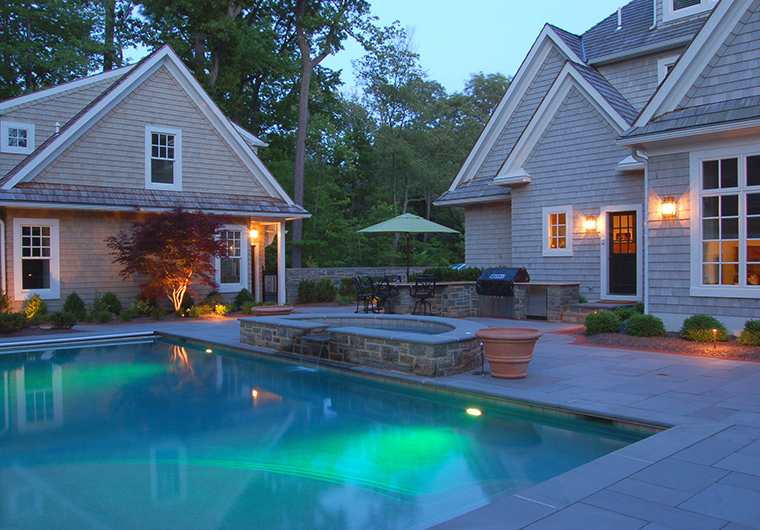 backyard pool with lights